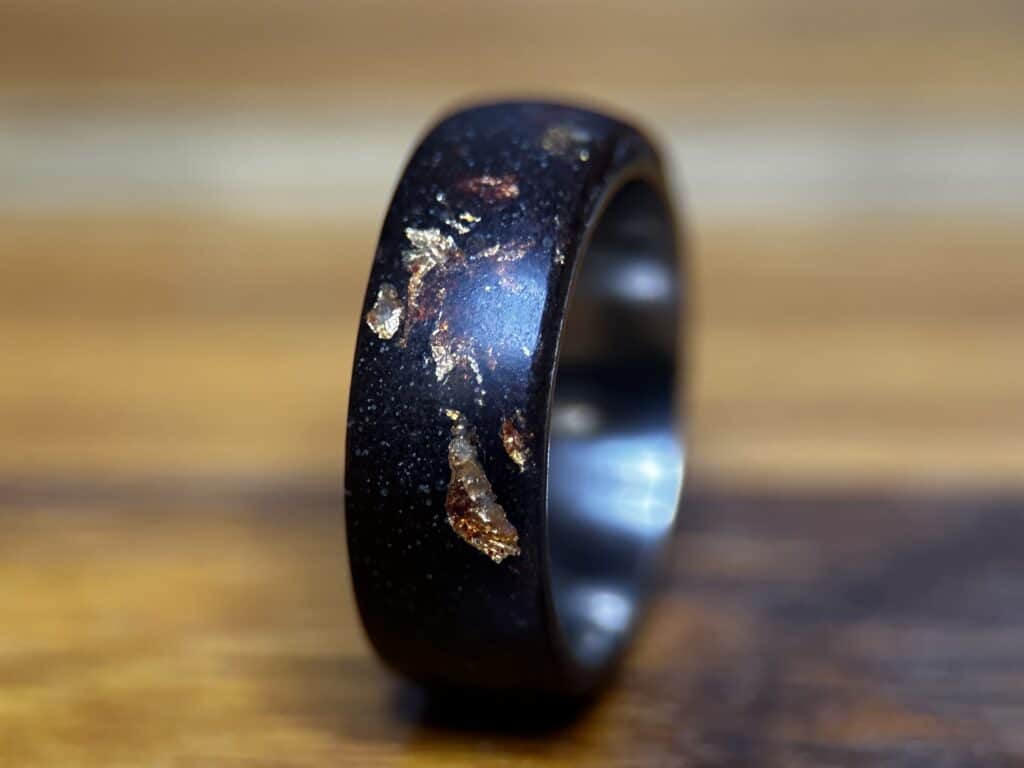 Dusty. A composite ring with gold sheet highlights and metal ring core.