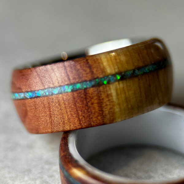 Two cedar wood rings with metal cores.