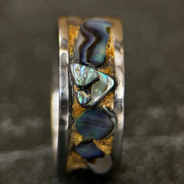 Sea and Surf Abalone Ring. Standing up with a silver edge, abalone shells, and golden sand inlay.