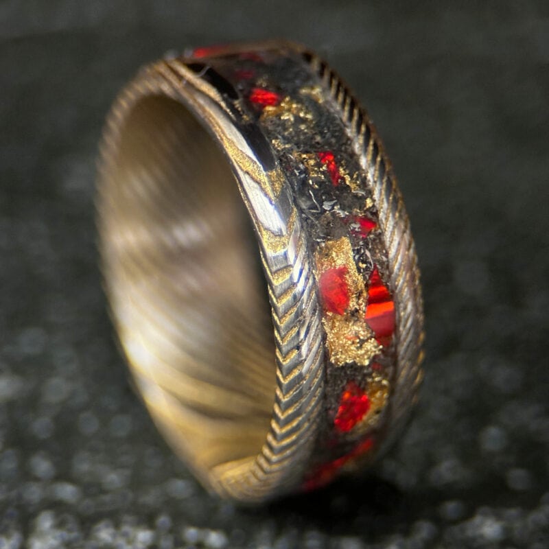 Golden Sky Fire ring with 24K gold plated stainless Damascus steel with gold leaf, meteorite, and red opal inlay. This is a Damascus steel ring.