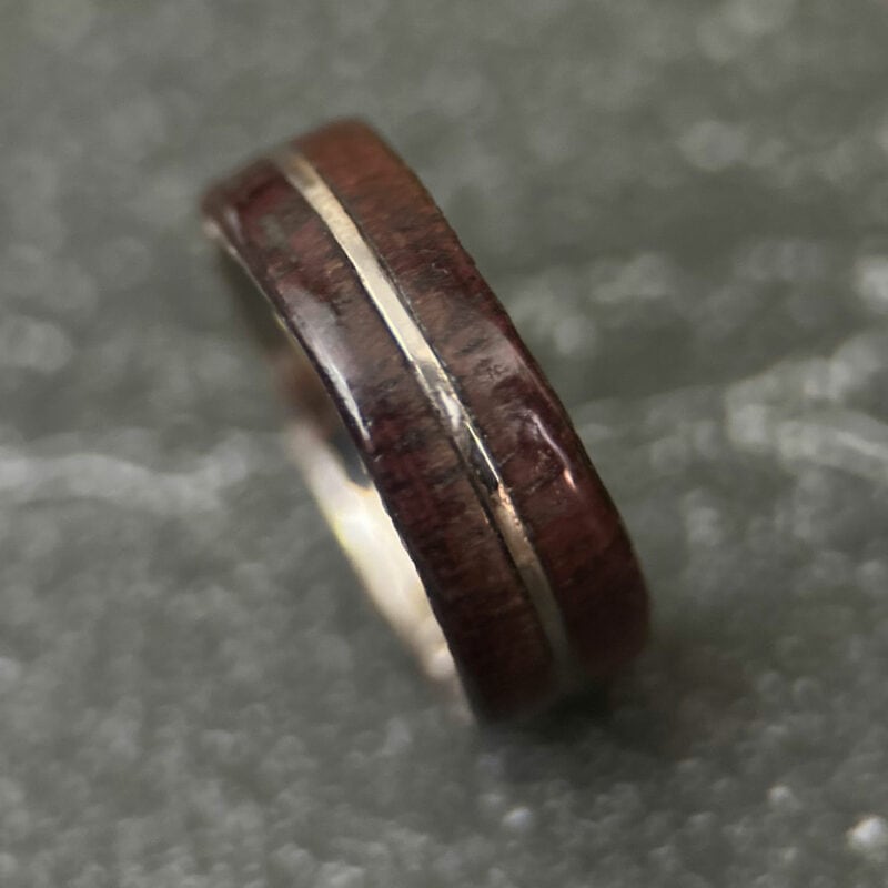 Purple heart ring with center metal inlay. Comfort core.