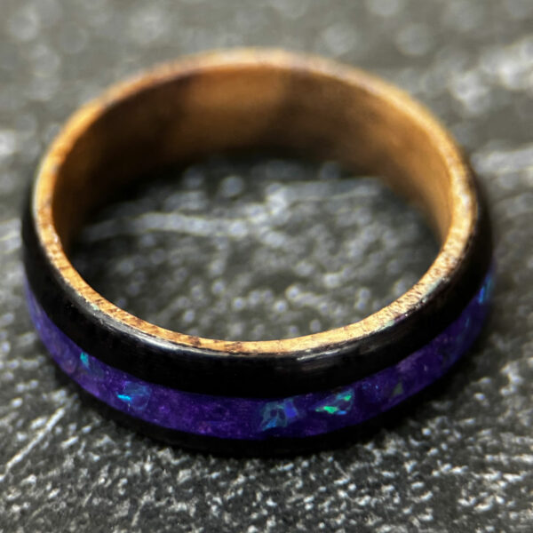 Indian rosewood with whiskey barrel core and purple opal inlay.