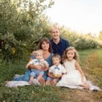 Picture of Nathan and his family in a field