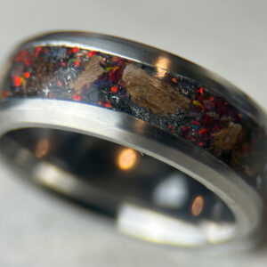 Dinosaur bone ring with meteorite fragments and magma opal.