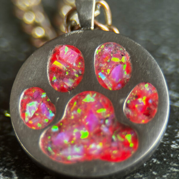 paw print pendant with pink opal inlay