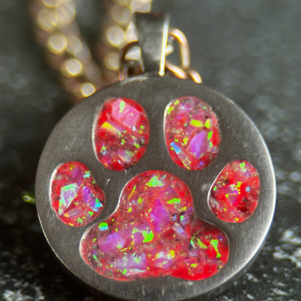 paw print pendant with pink opal inlay