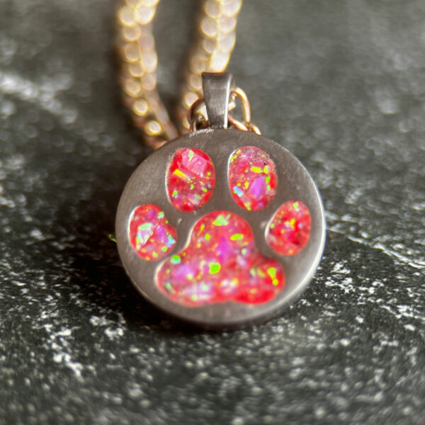 paw print pendant with pink opal inlay