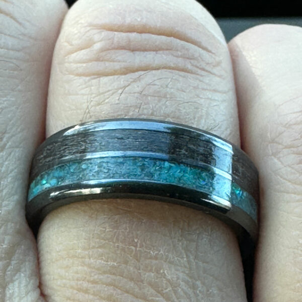 Wearing a double channel memorial ring with turquoise and hair.