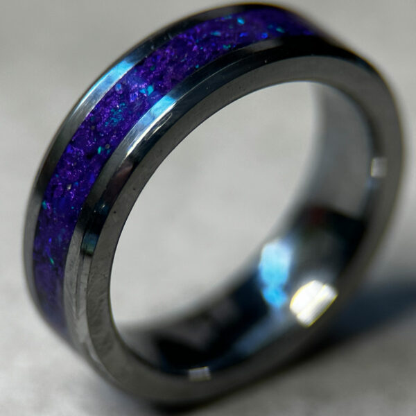 Tungsten ring with purple opal inlay.