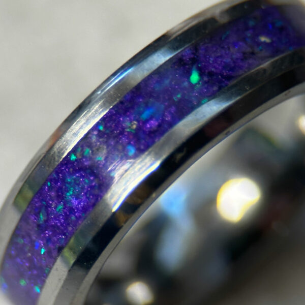 Tungsten ring with purple opal inlay.