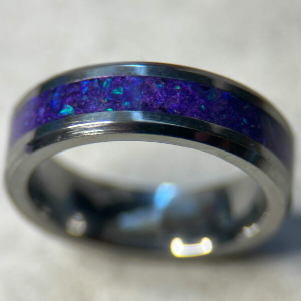 Tungsten ring with purple opal inlay.