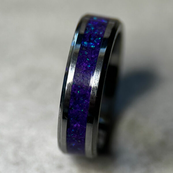 Tungsten ring with purple opal inlay.