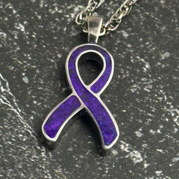 Cancer awareness ribbon pendant.