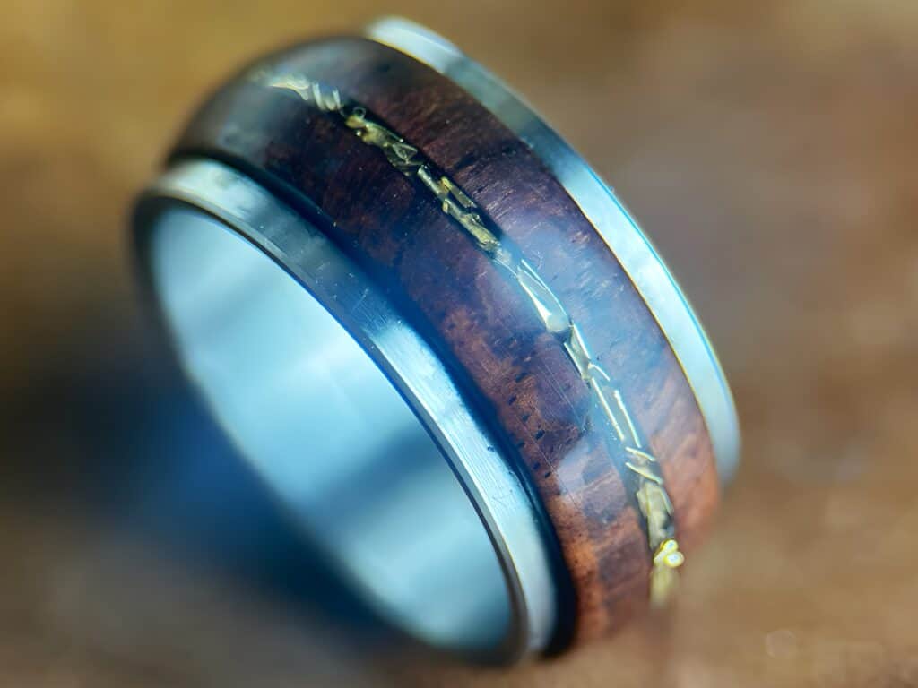 Rosewood and tank fidget ring on neutral background