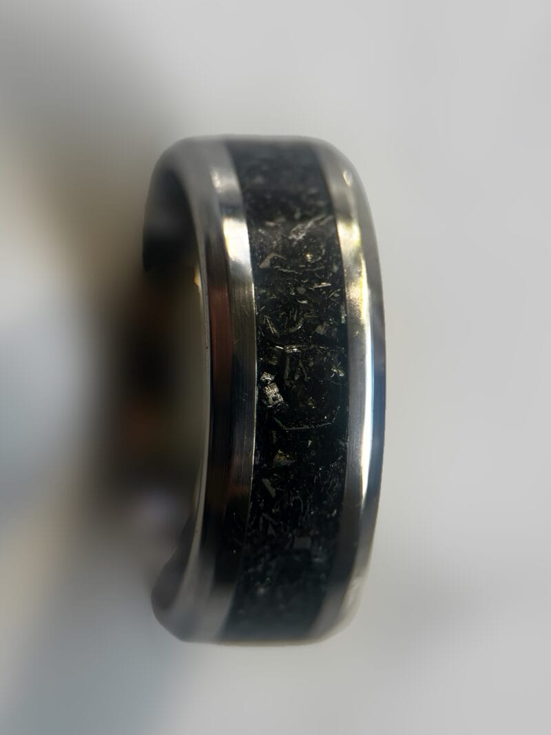 Mens wedding meteorite ring on neutral backgrond