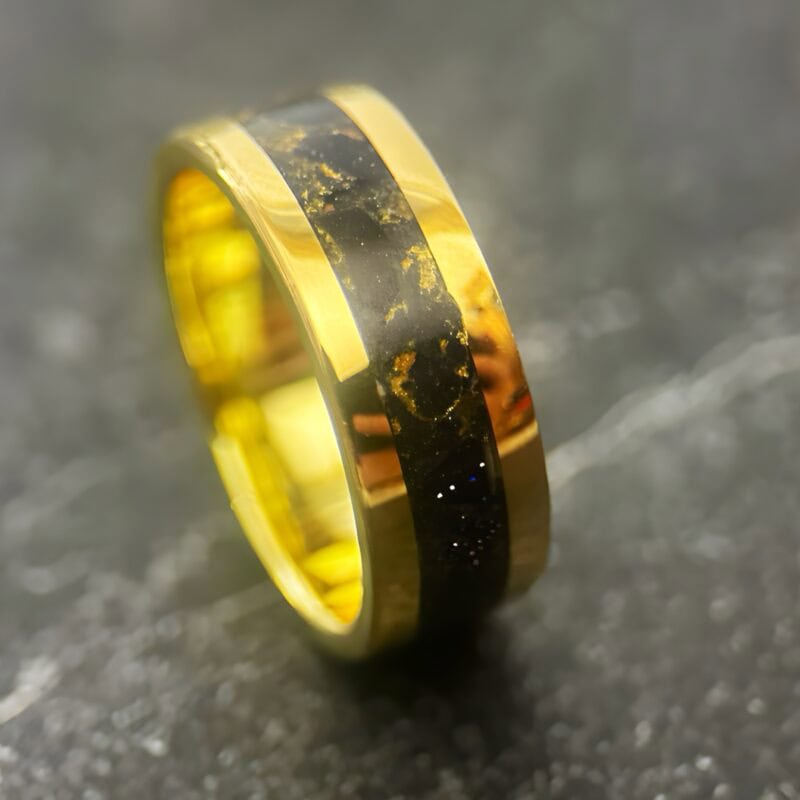 Nordic gold ring with blue gold stone inlay.