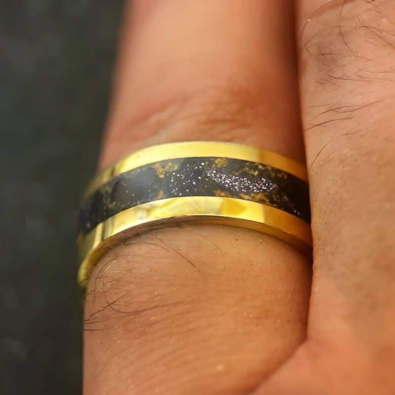 Nordic gold ring with blue gold stone inlay.