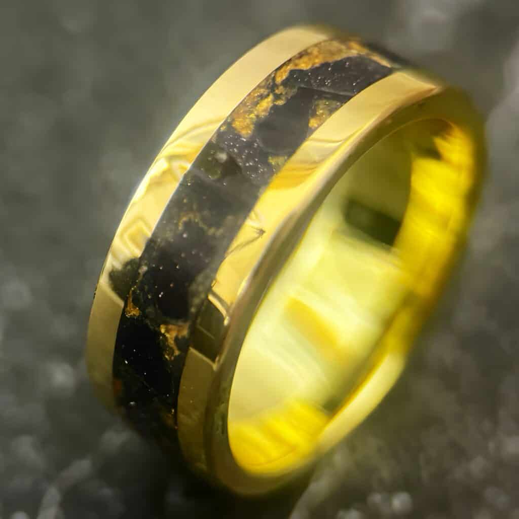 Nordic gold ring with blue gold stone inlay.