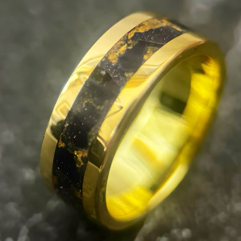 Nordic gold ring with blue gold stone inlay.