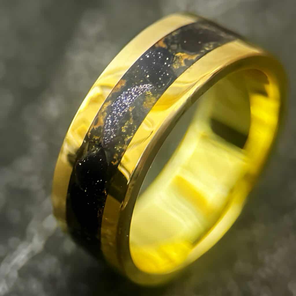 Nordic gold ring with blue gold stone inlay.