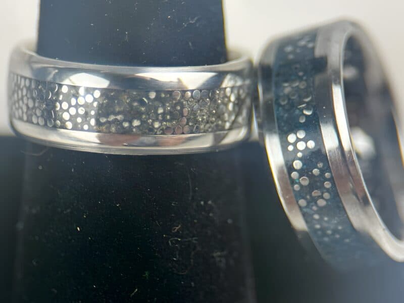 Dragon scale rings, one with black and the other with blue.