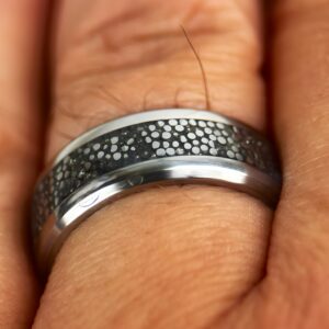 Dragon scale ring on finger.
