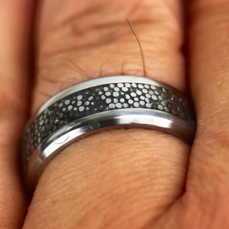Dragon scale ring on finger.
