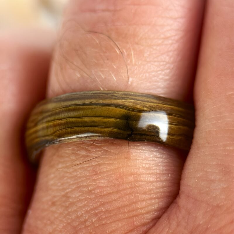 Driftwood copper ring on finger.