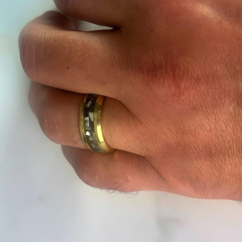 Golden Hunter - Nordic gold ring with mother of pearl and megalodon inlay on a finger
