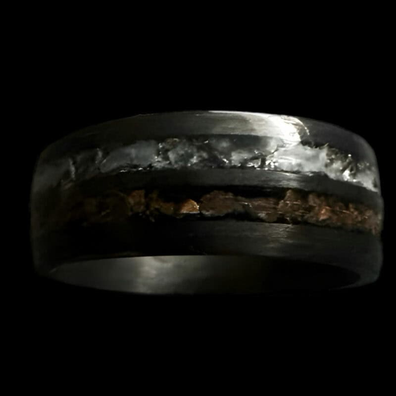 Hunter's Moon Ring. Moonstone and t-rex double channel ring on black background