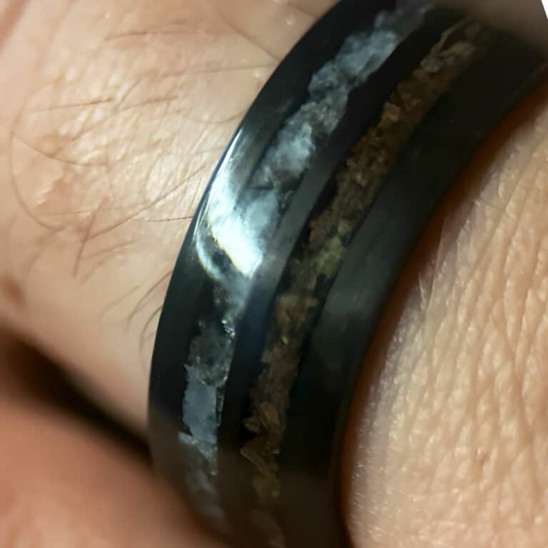 Hunter's Moon Ring. Moonstone and t-rex double channel ring on finger