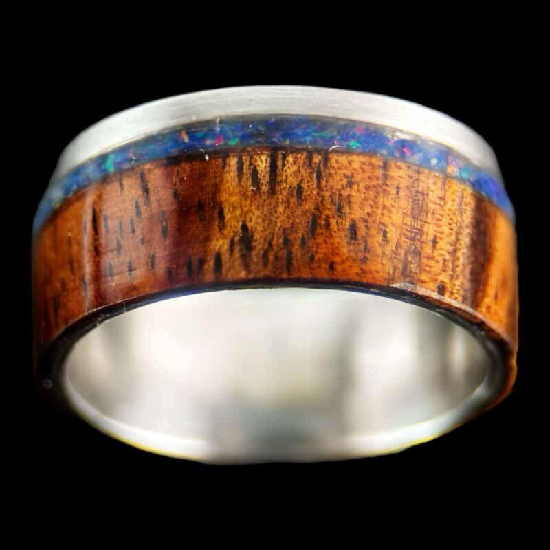 koa wood ring, live edge with stainless steel edge, stainless steel core, and opal inlay.