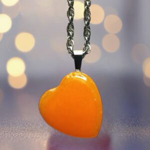 Glow in the dark heart pendant necklace.