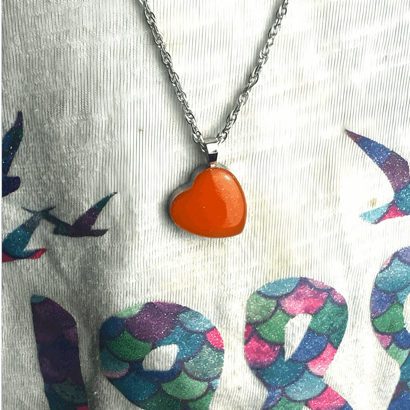 Glow in the dark heart pendant necklace.