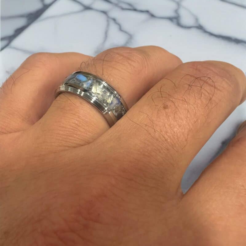 Opalite ring, available in several US sizes. Shown on a finger in front of marble.