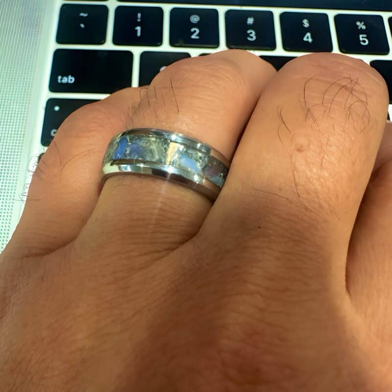 Opalite ring, available in several US sizes. Shown on a finger in front of a key board