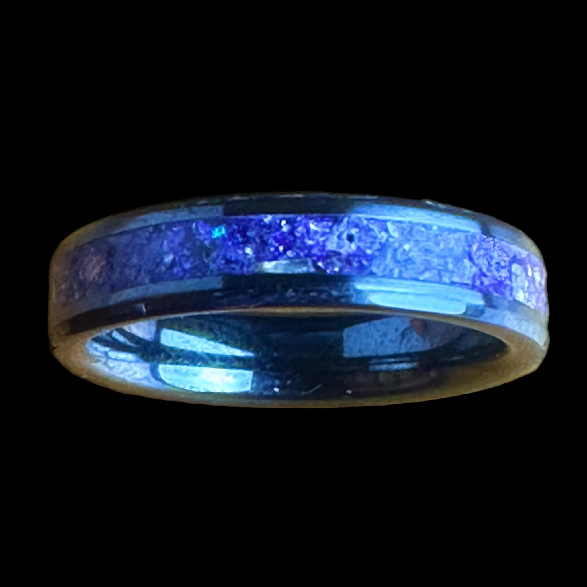 Purple glass ring. Black ceramic core. Set on a black background.